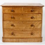 A late 19th century satin yew wood chest of drawers of two short and three long drawers,