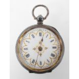 An open face mid size pocket watch. Circular white dial with Roman numerals and gold embellishments.