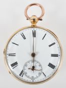 A yellow metal open face pocket watch.