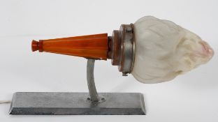 A 1920's Odeon light with tapered fluted Bakelite base and an acid etched flamiform shade,