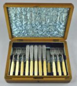 A late 19th/early 20th century oak canteen of silver plated cutlery