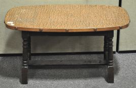 A copper topped coffee table,