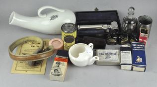 A group of medical collectable's including a lamp and various glass bottles