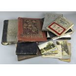 An old suitcase of early books and scrapbook,
