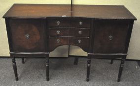 A modern mahogany veneer sideboard, three central drawers flanked by single cupboard to either side,