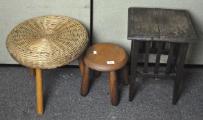 Two foot stools and a stained wood side table,