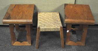 A pair of wooden stools together with a wicker example,