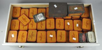 A large collection of Wills tobacco tins, all containing various electrical components,