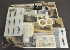 A collection of assorted prints and postcards, including a selection of black and white photographs,