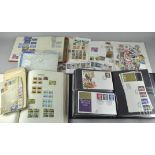 A quantity of assorted first day covers and stamps,