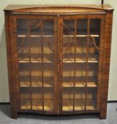 A 1950's walnut display cabinet,
