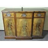 A mahogany veneered sideboard with inlaid borders, three drawers above three cupboards,