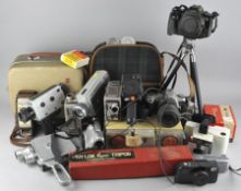 A selection of cameras and camera equipment, including Canon eos 500, a cine cameras,