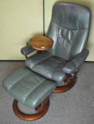 A faux leather Stressless reclining armchair with swivel drinks tray to one side,
