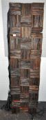 An abstract wood and carved rubber wall mounted sculpture,