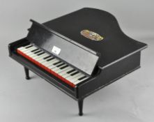 A blue ribbon baby grand piano,