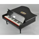 A blue ribbon baby grand piano,