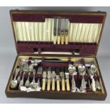 A large mid-century oak canteen of cutlery by Webber and Hill, 21 place setting,