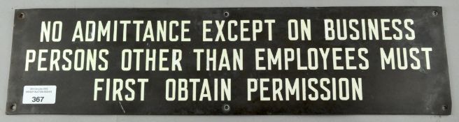 A bronze wall sign 'No admittance except on business',