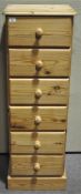 A tall pine chest with six drawers,