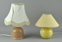 Two table lamps, of small ovoid form, with ceramic bases,