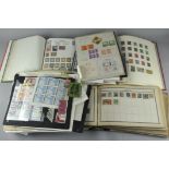 A collection of assorted stamps and first day covers in numerous albums,