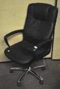 A black vinyl and steel computer chair,