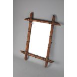 A vintage faux bamboo framed mirror, possibly French,