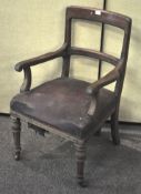 A 19th century oak armchair with plain back and scroll arms, on turned and fluted legs,