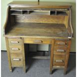 A 20th century roll top oak desk, with tambour shutter (A/F),