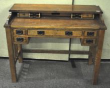 A 20th century oak desk, lacking roll top, the front with two long and four short drawers,