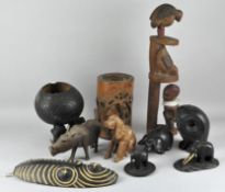 A collection of carved wooden items, including Chinese bamboo brush pot, ebony elephant figure,