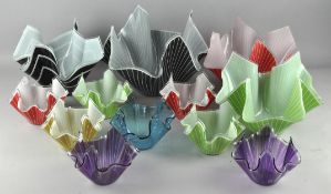 A collection of mid-century coloured napkin glass dishes/bowls of varying sizes,