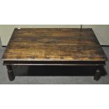 A large Anglo-Indian brass bound hard wood coffee table, 41cm x 135cm x 91cm.
