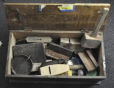 A collection of carpenter's tools in a pine chest