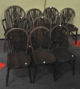 A set of ten oak wheel back dining chairs