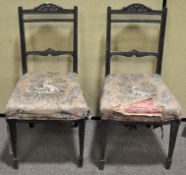 A pair of Victorian ebonised aesthetic style salon chairs,