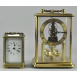 An H Samuel brass cased Anniversary clock, 21cm high,