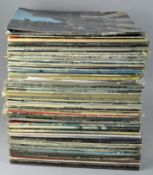 A collection of LP records, including the Beatles,