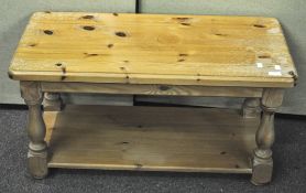 A pine coffee table of rectangular form,
