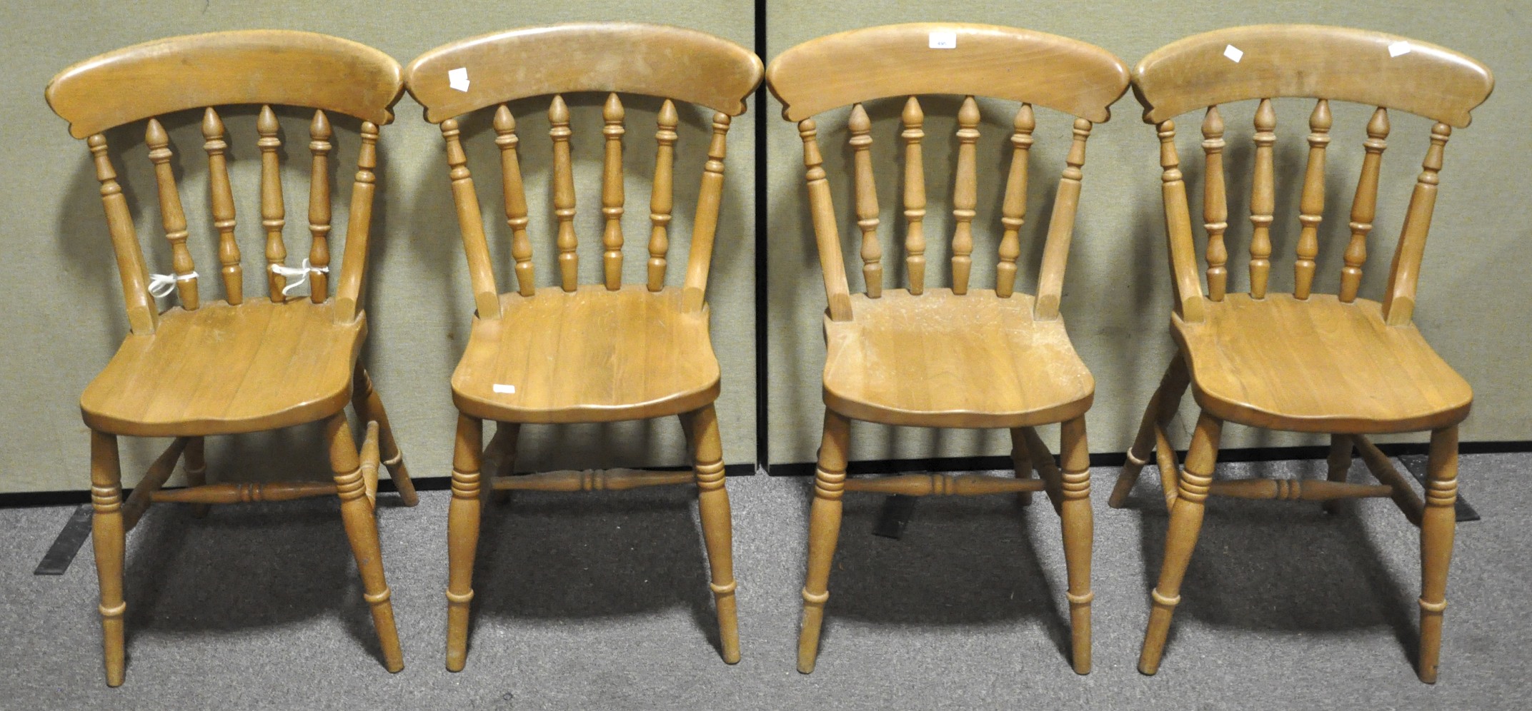 A set of four elm kitchen chairs,