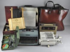 An assorted collection of items, including a typewriter, a retro radio and more