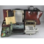 An assorted collection of items, including a typewriter, a retro radio and more