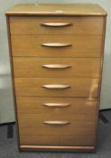 A mid-century chest of five drawers, including a large filing drawer to base,