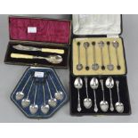 Four cased sets of silver flatware, including three sets of coffee spoons,