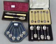 Four cased sets of silver flatware, including three sets of coffee spoons,