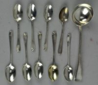 A collection of various silver spoons, including a Victorian ladle,