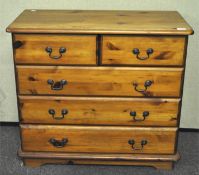A pine chest of drawers, two short over three long drawers,