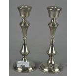 A pair of modern silver candlesticks with filled bases, hallmarked Birmingham 1991,