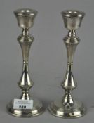 A pair of modern silver candlesticks with filled bases, hallmarked Birmingham 1991,